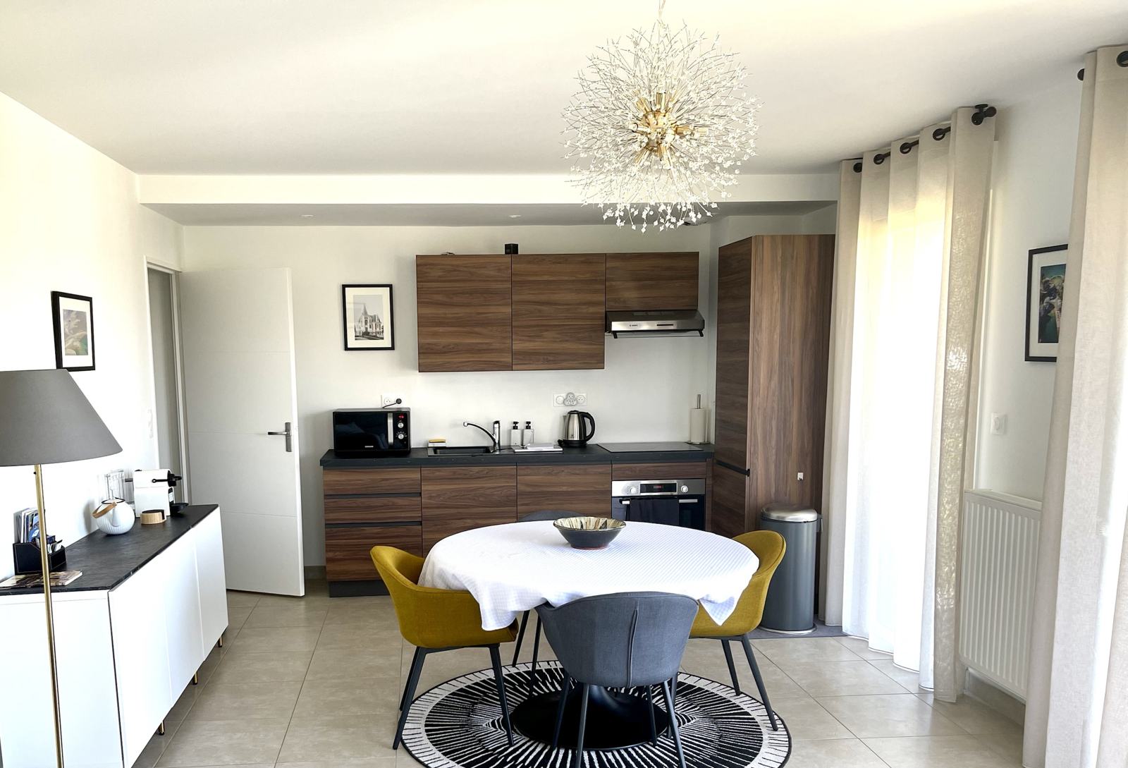 Round walnut table and kitchen